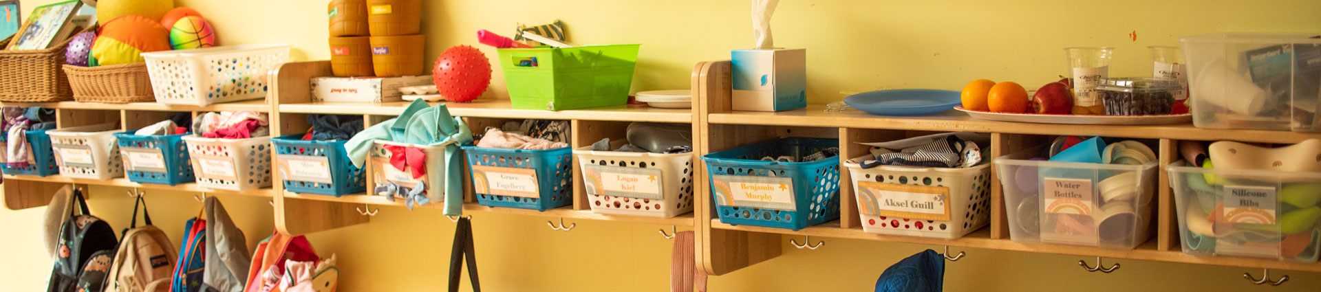 A shelf with student's supplies and backpacks