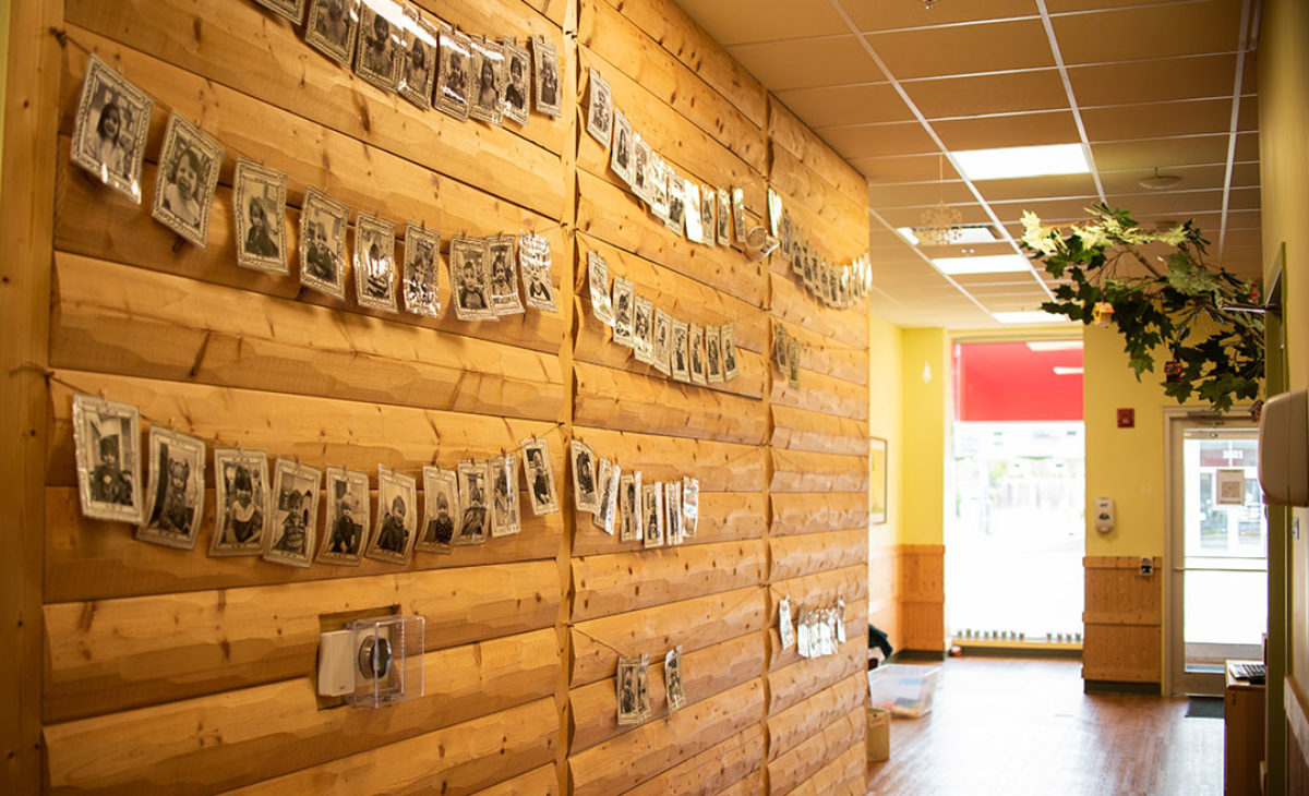 Little GReen Treehouse student pictures hung on wall