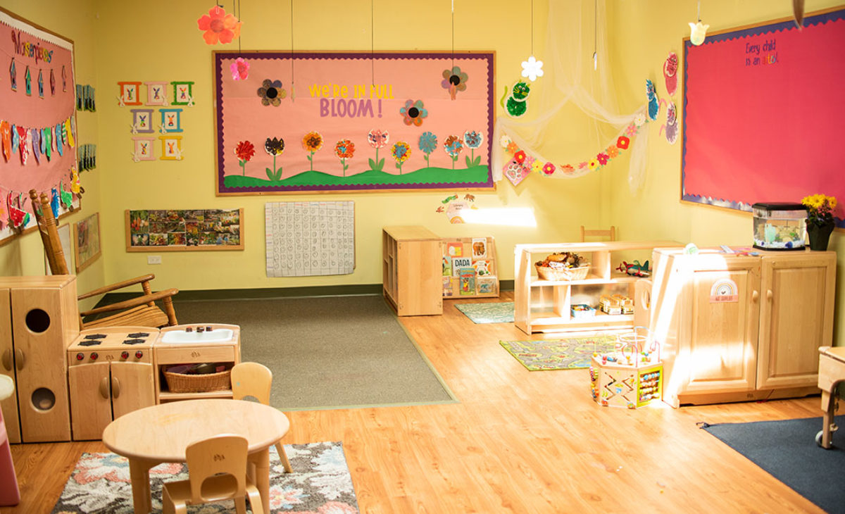 Large playroom with tables and chairs
