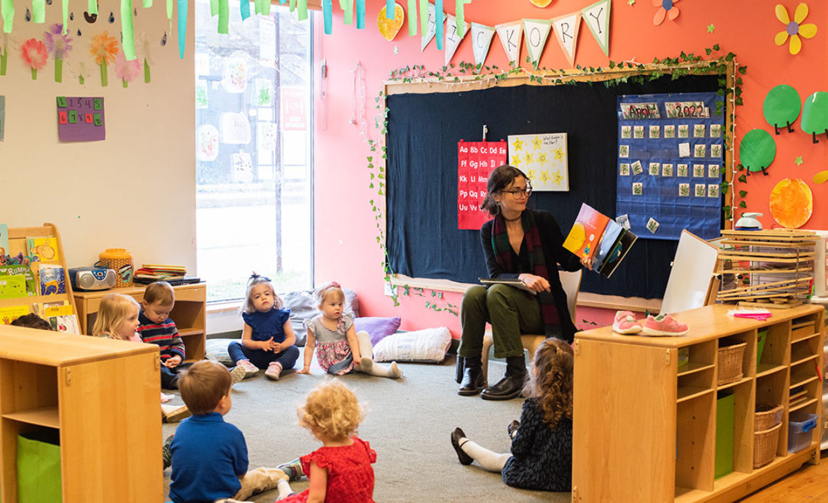 Lakeview teacher reads to a group of toddlers