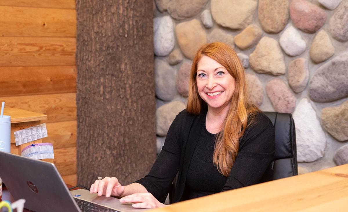 Little Green Treehouse employee at desk