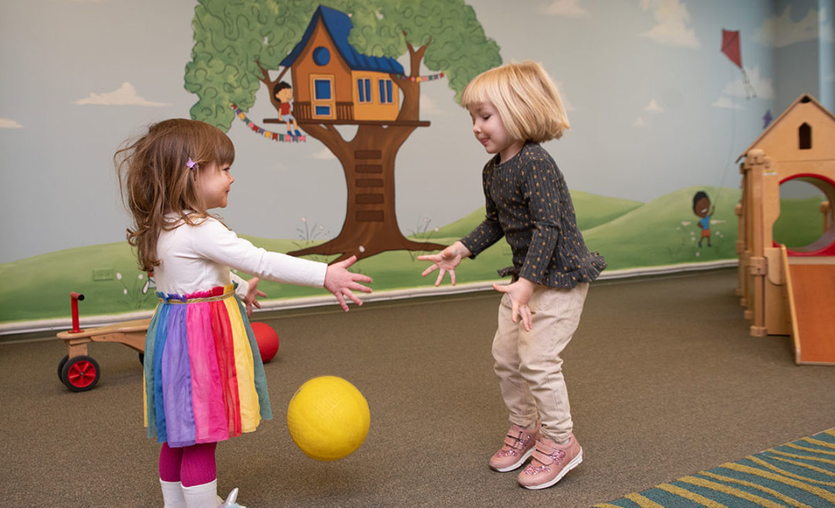 2 toddler girls playing together